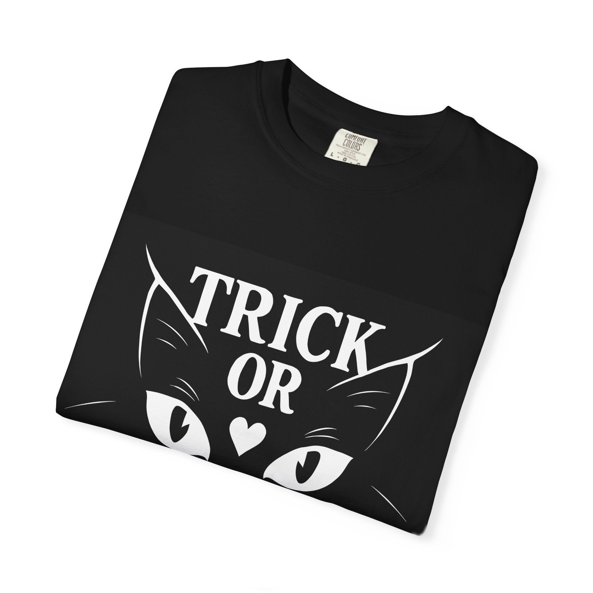 Black Halloween cat t-shirt folded with “TRICK OR CLAW” graphic on front