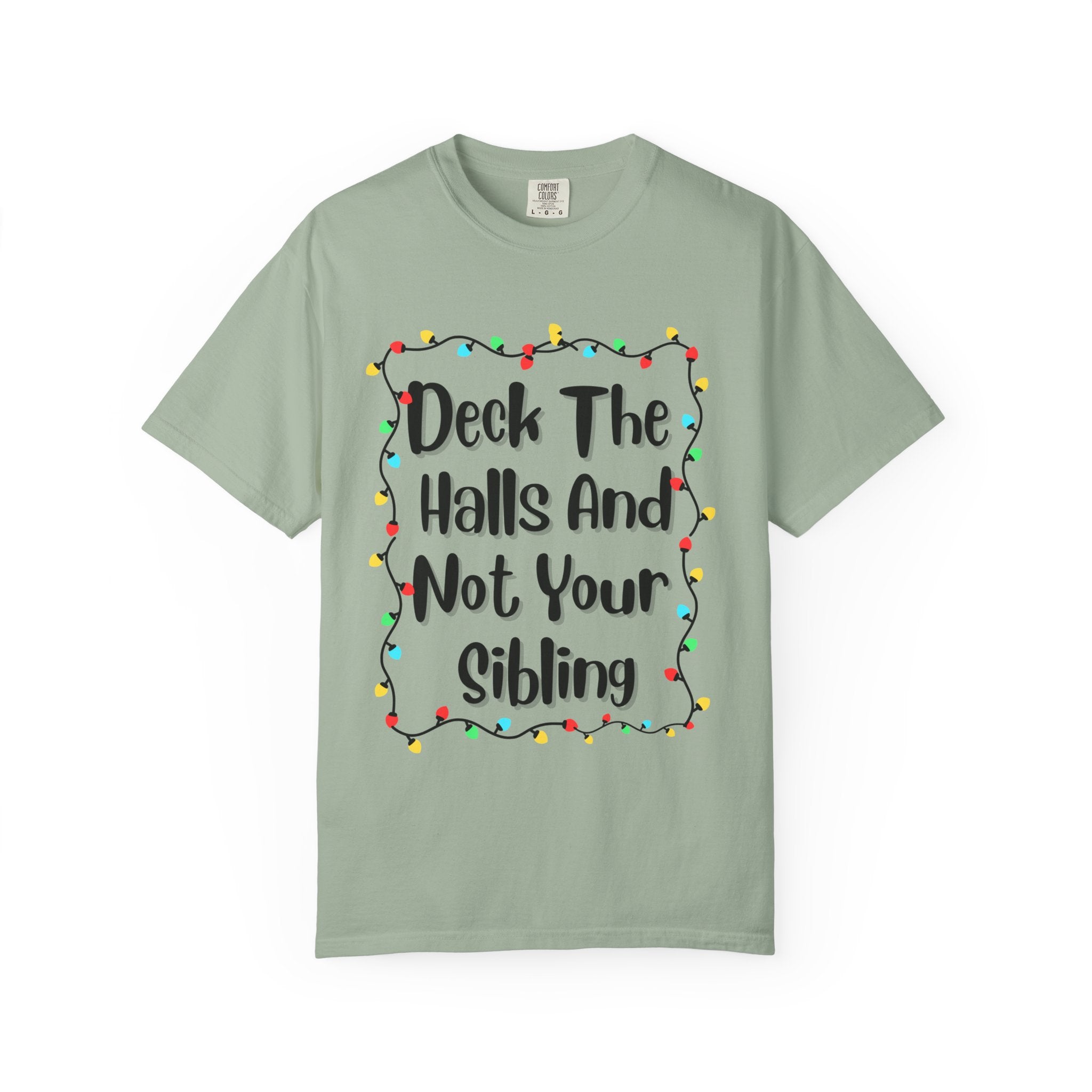 Light green T-shirt with colorful holiday lights border and funny text graphic