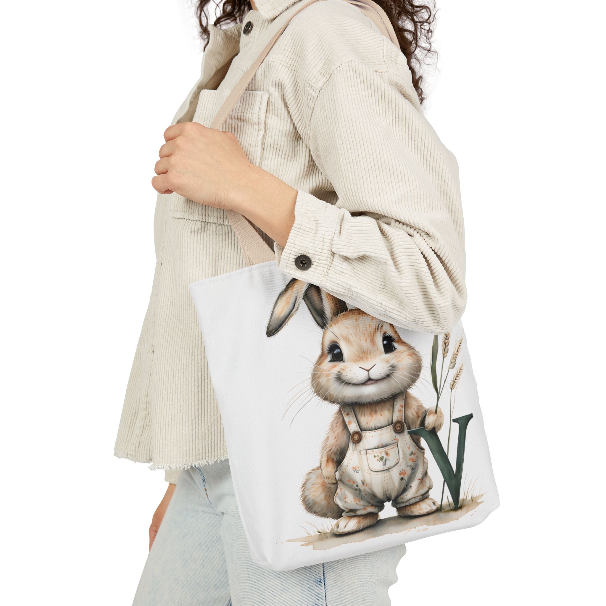 Canvas tote bag with rabbit graphic on white front and beige shoulder straps
