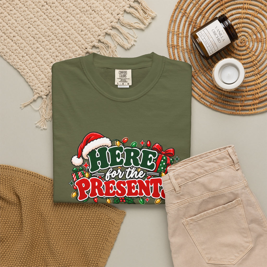 Olive green T-shirt with 'Here for the Presents' festive logo on front