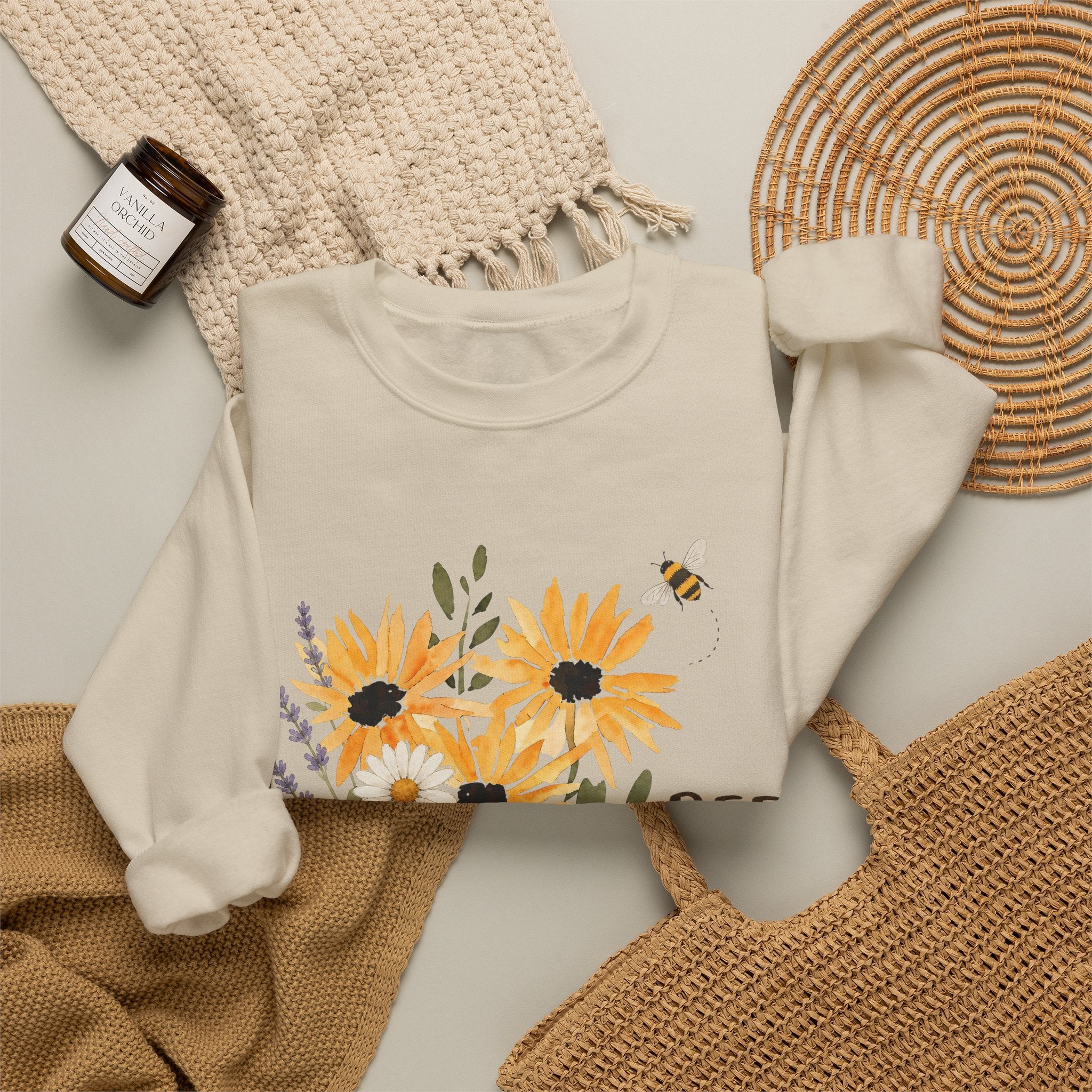 Cream crewneck sweatshirt with sunflower bouquet graphic, front view crop