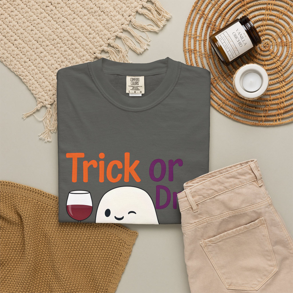 Charcoal Halloween ghost t-shirt on flat lay with 'Trick or Drink' ghost and pumpkin