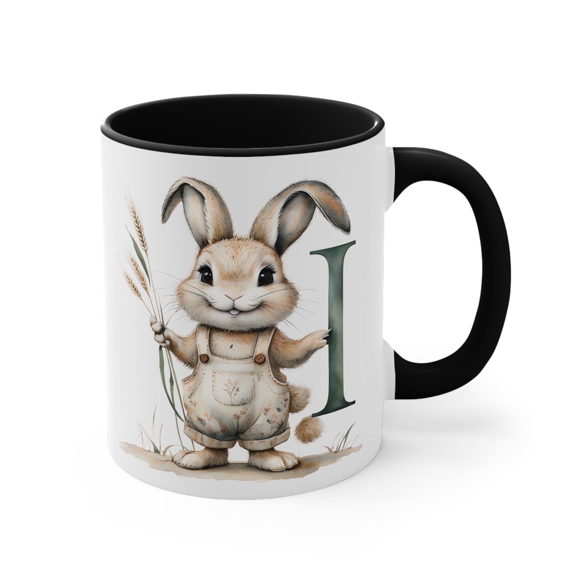 White mug with black handle, bunny illustration and letter I on the front