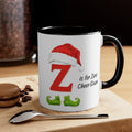White mug with black handle; red Z, Santa hat, and 'is for Zero Cheer Given'