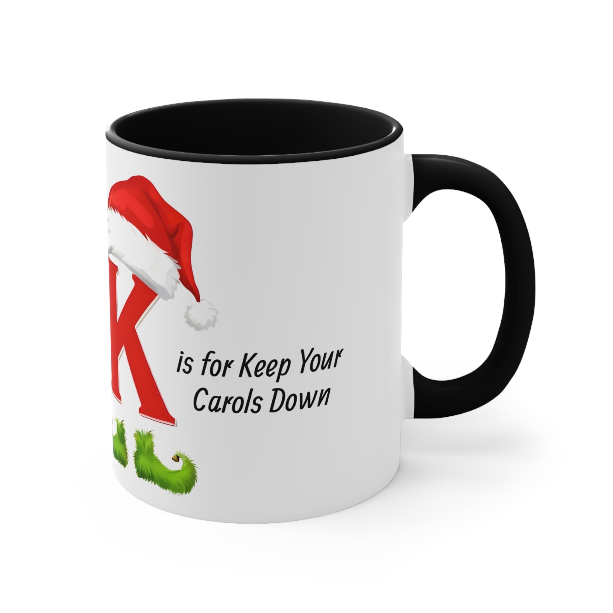 White mug with black handle, K letter and Keep Your Carols Down holiday text.
