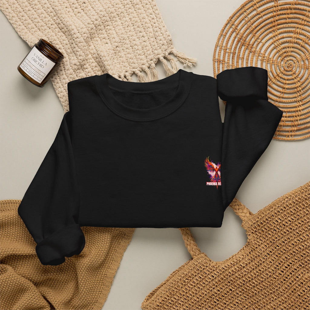 Black crewneck sweatshirt with small phoenix bird graphic and long sleeves