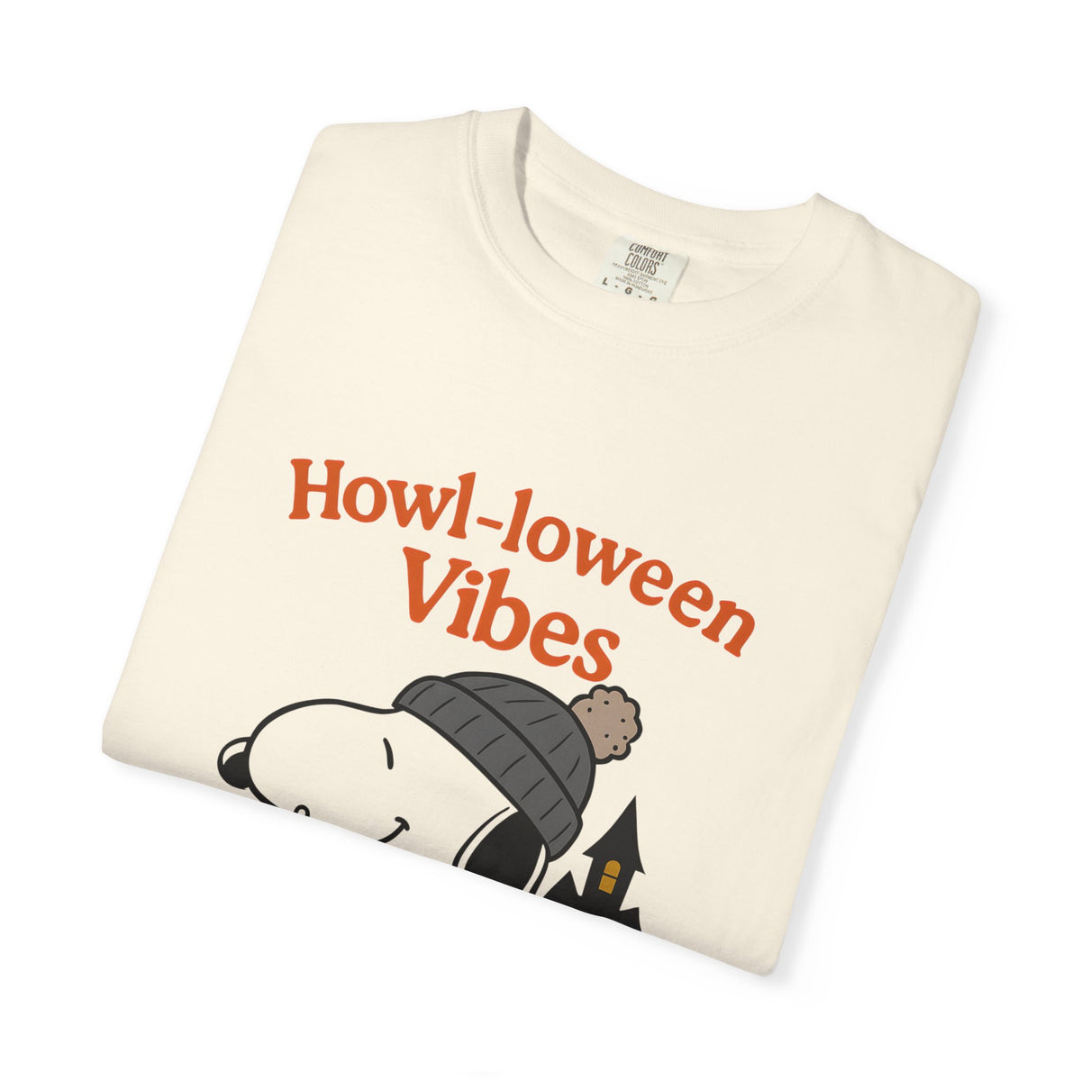 Ivory dog Halloween graphic t-shirt, folded front with “Howl-oween Vibes” print