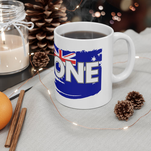 White ceramic coffee mug with blue Australia flag map graphic and 'ONE' lettering