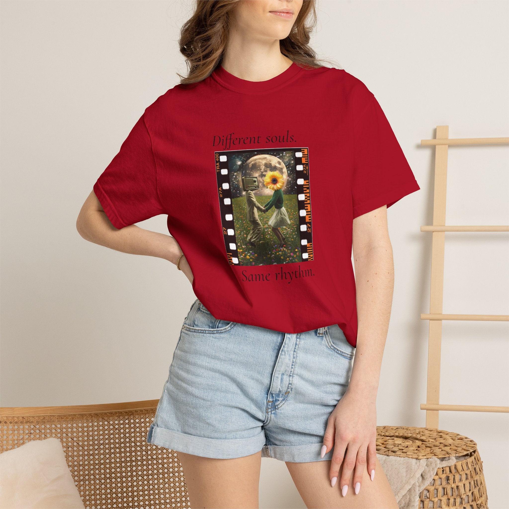 Red crewneck T-shirt worn by model with filmstrip graphic on front