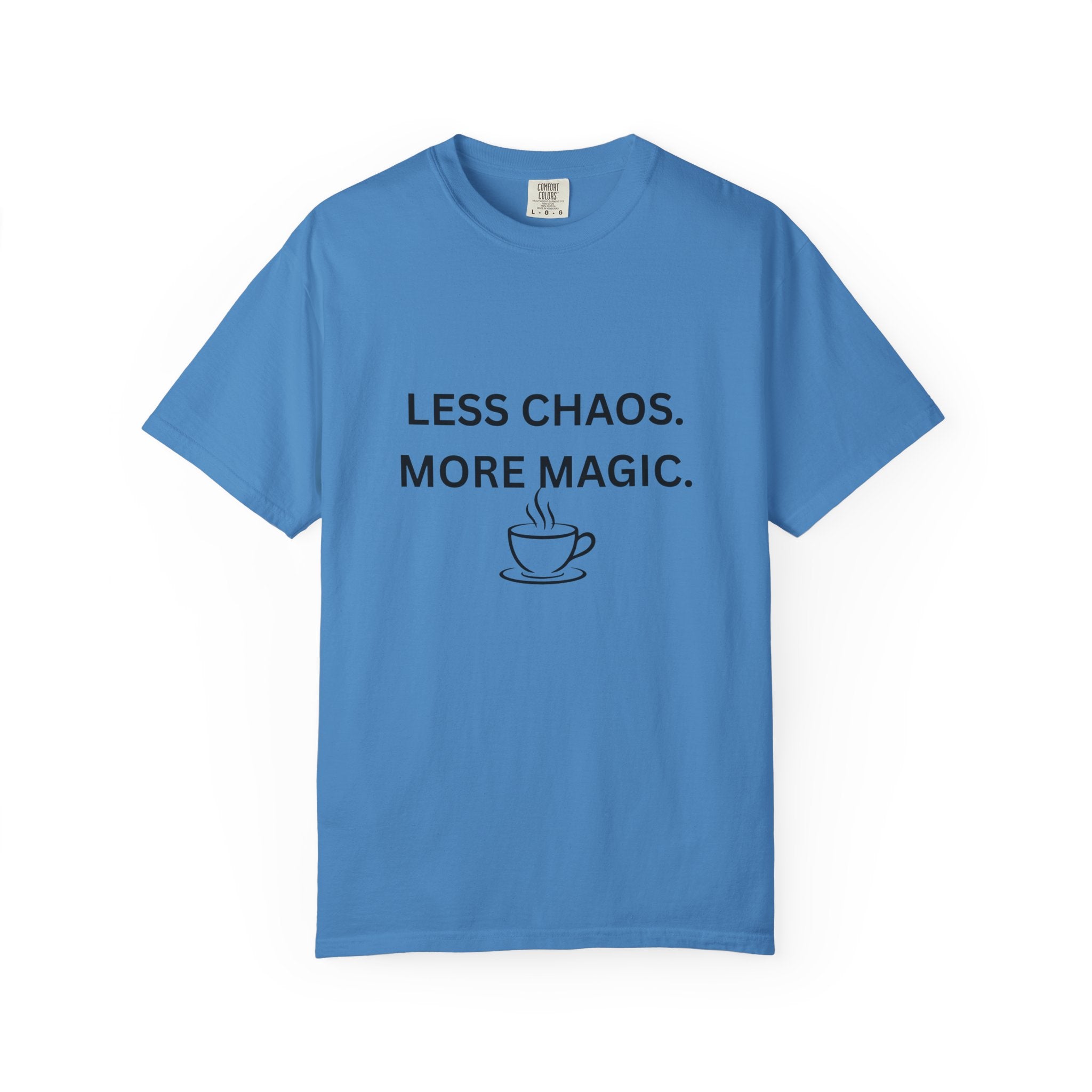 Blue T-shirt with “LESS CHAOS. MORE MAGIC.” text and a coffee cup graphic